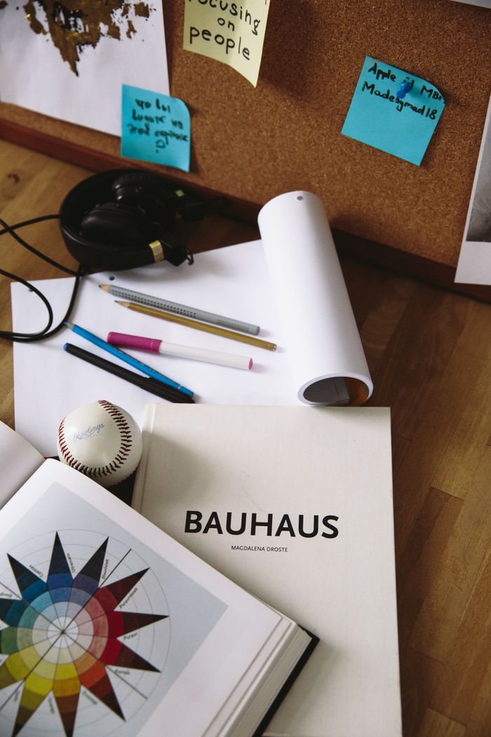 our-experience Artistic desk setup featuring Bauhaus book and design tools for creative inspiration.