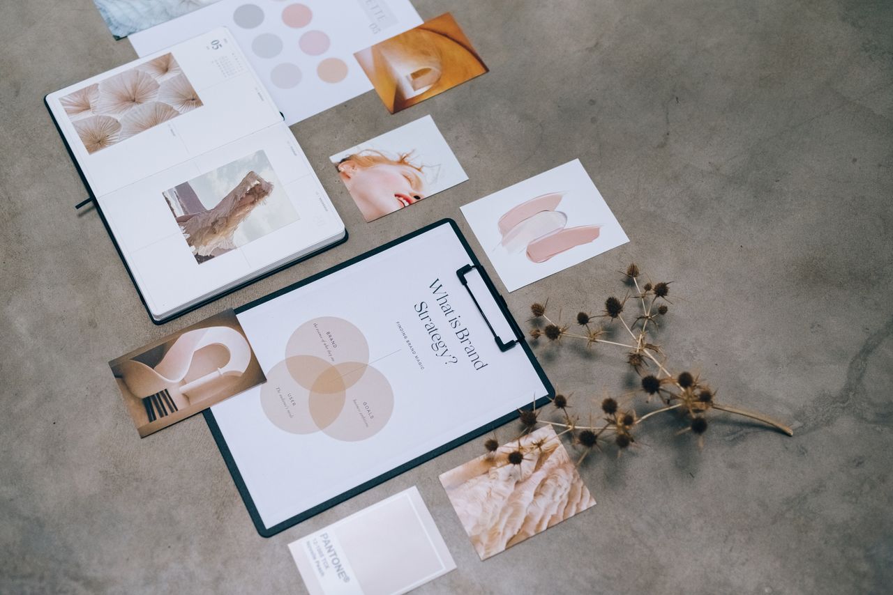 services-02 A modern flat lay of branding strategy documents and design elements on a desk.